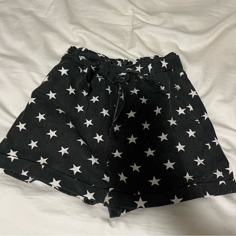 Black and white star paper bag shorts with buttons and a tie belt